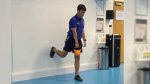 Man performing a single leg Wall RDL