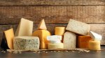 Various cheeses displayed on a board